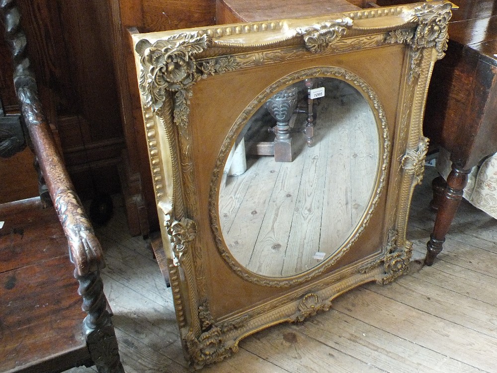 A gilt wood decorative wall mirror