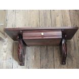 A carved mahogany single drawer wall hanging bracket