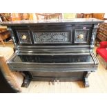 An ebonised piano with ivory keys by Rud IBach Sohn,