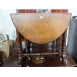 A Victorian mahogany oval Sutherland table plus a box of keys