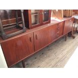 A 1970's G-Plan sideboard with four drawers and three doors