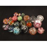 A tray of various glass paperweights