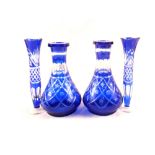 Two pairs of Bohemian blue overlaid glass vases