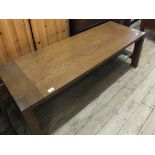 A rectangular oak coffee table