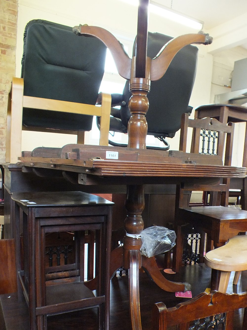 A reproduction mahogany D end table with single leaf