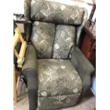 An electric reclining chair in modern brown and cream upholstery