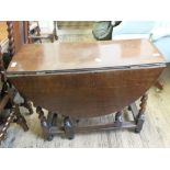 A 19th Century oval oak barley twist gate leg table and a horse on a stand