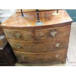 A Georgian mahogany bow fronted chest of two short and two long drawers on bracket feet