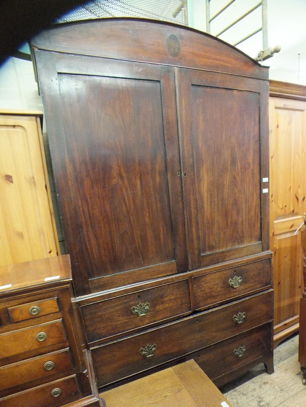 A 19th Century mahogany linen press over two short and two long drawers