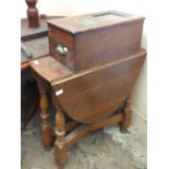 An oval gate leg table and a mahogany drawer cash till by G.H.