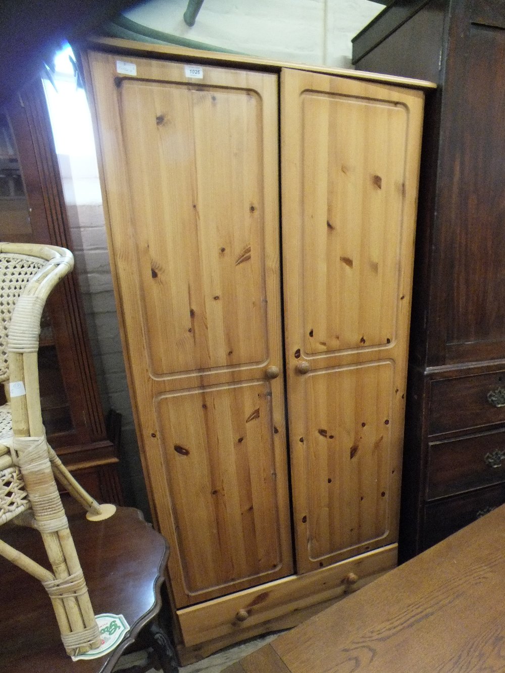 A modern pine two door wardrobe