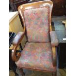 A Victorian mahogany floral upholstered frame armchair