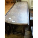 A 19th Century oak gate leg table on bobbin turned legs and an early 20th Century bi-fold wooden