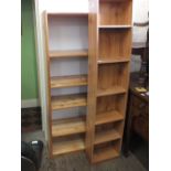 A modern pine five shelved bookcase plus one other