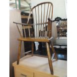 A 19th Century country made stick back elbow chair