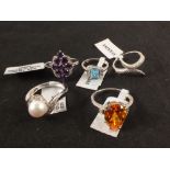 A group of five silver stone set rings including amethyst, diamond,