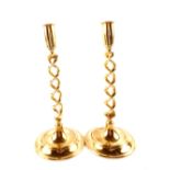 A pair of Edwardian open barley twist brass candlesticks,