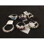 Six silver stone set rings including topaz and amethyst etc