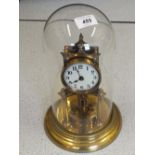 A brass 400 day anniversary clock with 20/03/1913 receipt, movement made in Germany, S/No.