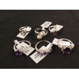 A group of six silver stone set rings including opal,