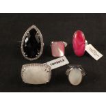 A group of five silver stone rings including spinel,