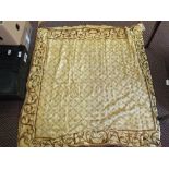 A gilt thread embroidered throw