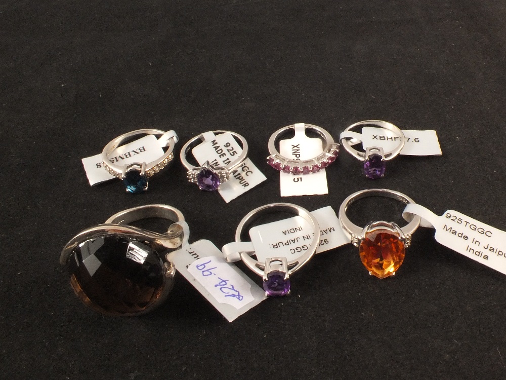 A group of seven silver stone set rings including quartz,
