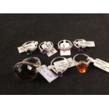 A group of seven silver stone set rings including quartz,