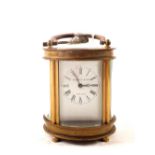 An oval brass Elliott & Son carriage clock