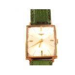 A gents Longines 9ct gold cased rectangular wristwatch on green leather strap