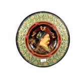 A relief Majolica wall plate of a tyrolean man,