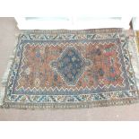 A Persian rug with central medallion,