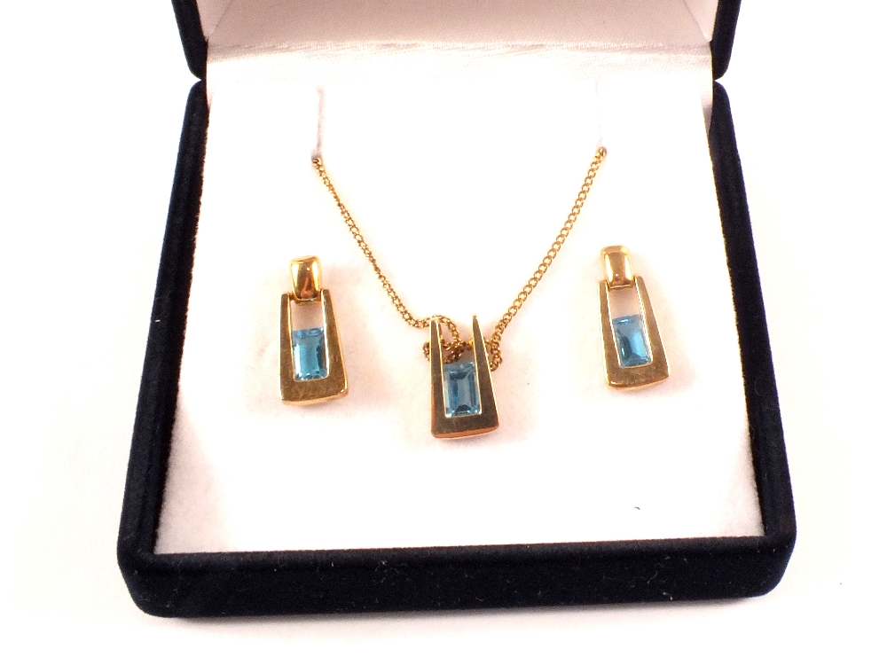 A 9ct gold blue stone pendant and earrings