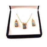 A 9ct gold blue stone pendant and earrings