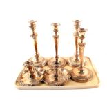 Two pairs of silver plated on copper candlesticks plus a pair of chambersticks