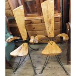 A pair of unusual bespoke hardwood and wrought iron chairs