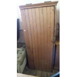 A pine single door cupboard