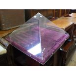 A pyramid shaped perspex jewellery display cabinet with purple velvet covered hinged base