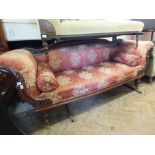 A Victorian scroll end three seat salon settee with floral upholstery,