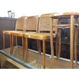 Three Dinette Polish bentwood chairs with cane back and seat, a cane seat stool,