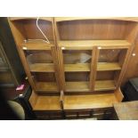 A Nathan teak glazed combination display cabinet with cupboards below (in two sections)