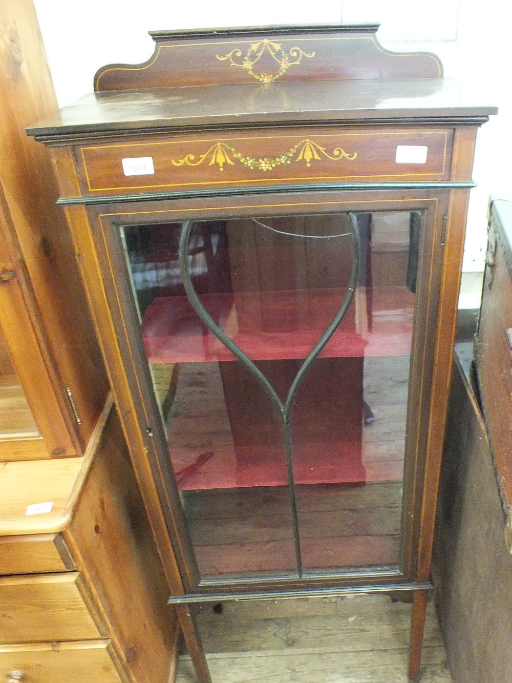 An Edwardian mahogany astral glazed display cabinet with painted decoration