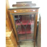 An Edwardian mahogany astral glazed display cabinet with painted decoration