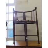 A mahogany half moon inlaid bedroom chair with modern upholstery