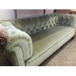 A light green draylon upholstered Chesterfield sofa