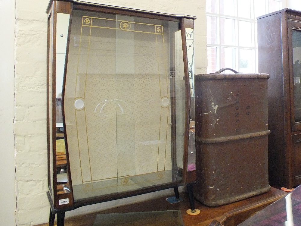A rather kitsch 1950's glass and mirror display cabinet and vintage travelling trunk