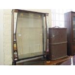 A rather kitsch 1950's glass and mirror display cabinet and vintage travelling trunk