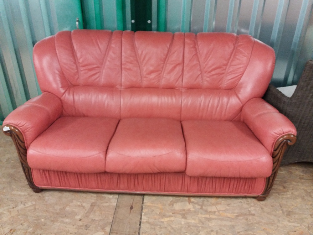 A modern Italian style wood and terracotta leather upholstered sofa