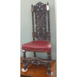 A Carolean style hall chair with central shell,