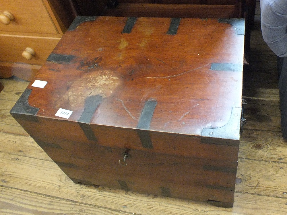 A mahogany and metal bound chest with iron handles and internal candlebox and key